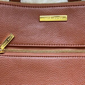 Luxurious Brown Leather Backpack with Gold Zippers